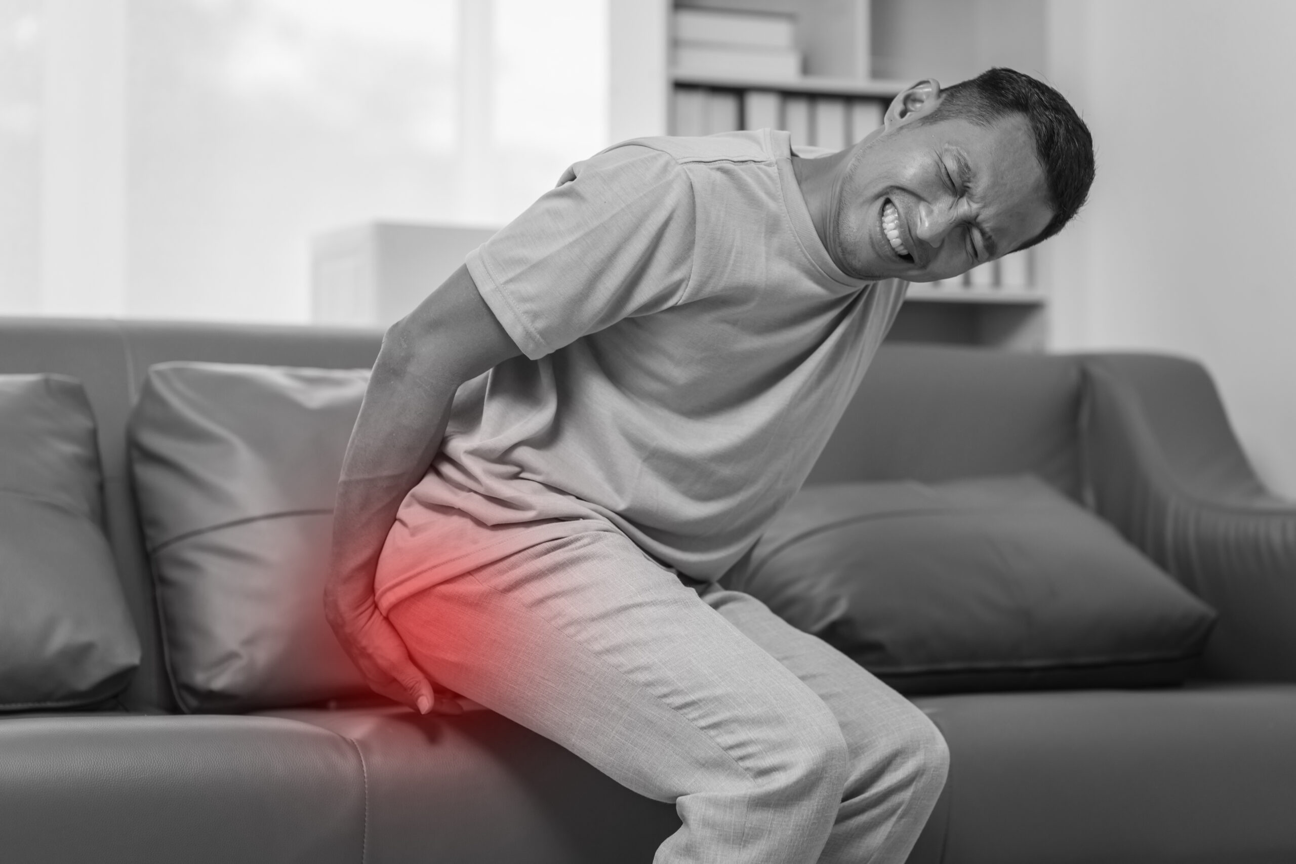 Man experiencing pain near the anus