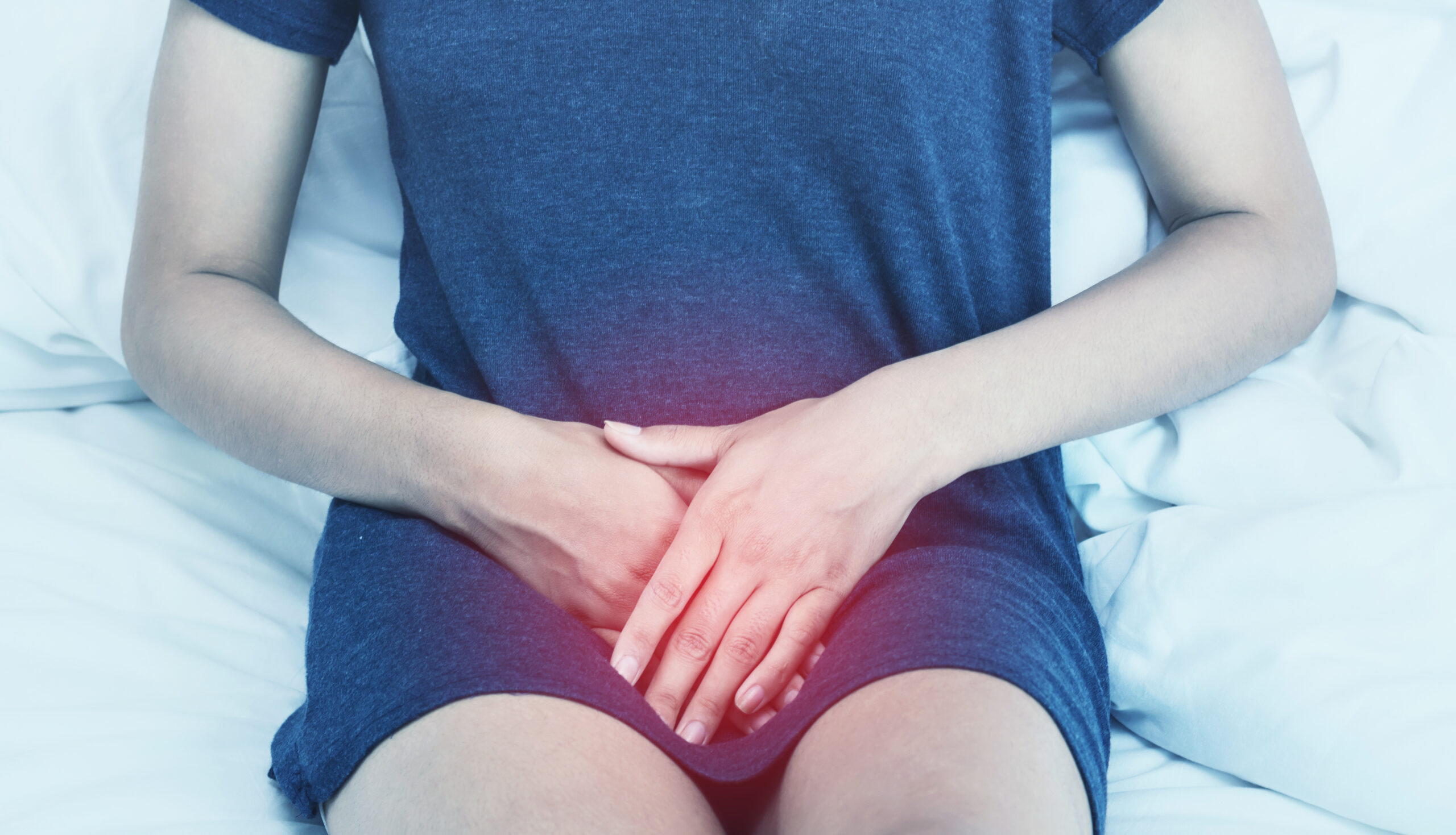 A woman experiencing pain in the groin.